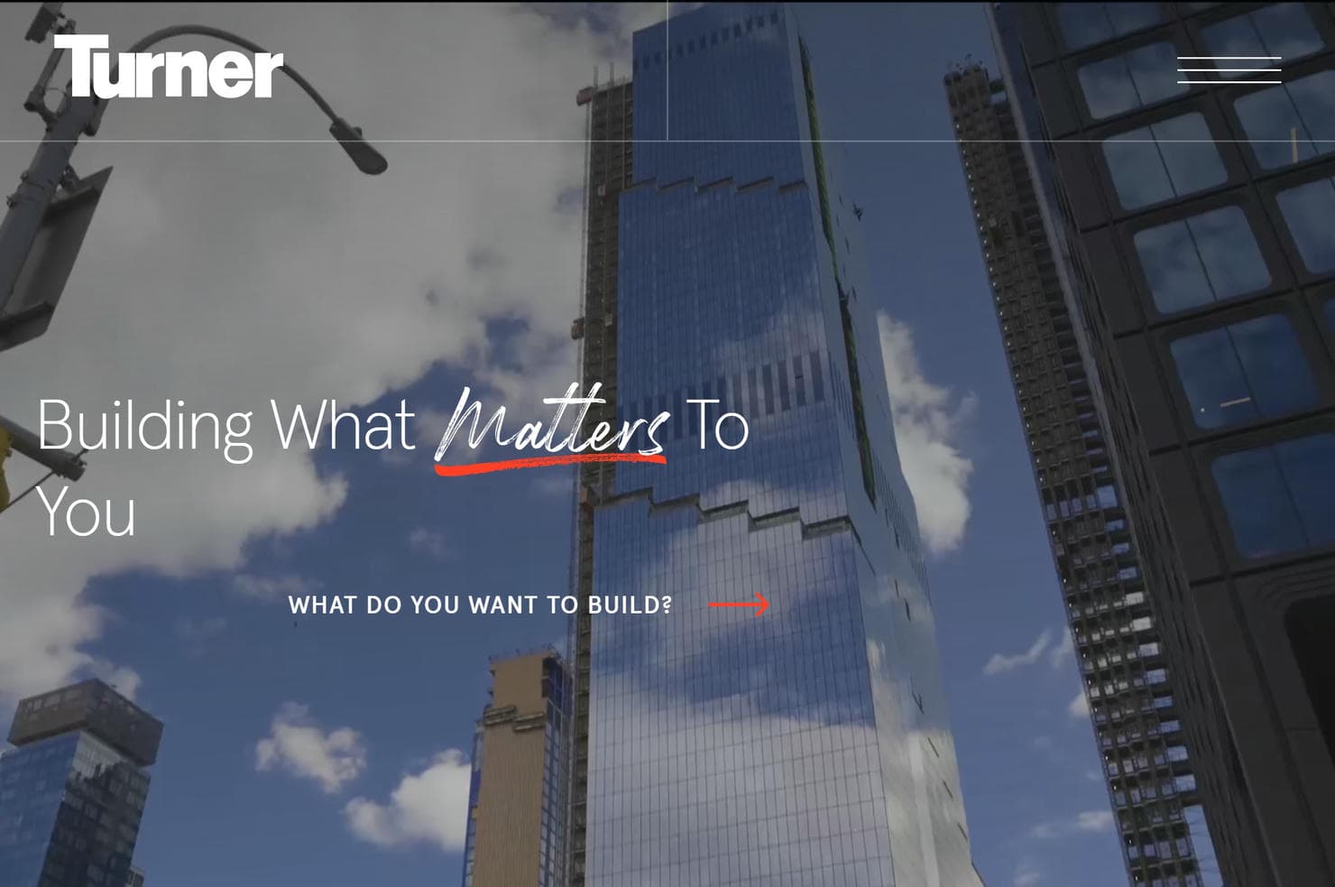 A tall building in front of a skyscraper on Turner Construction's website