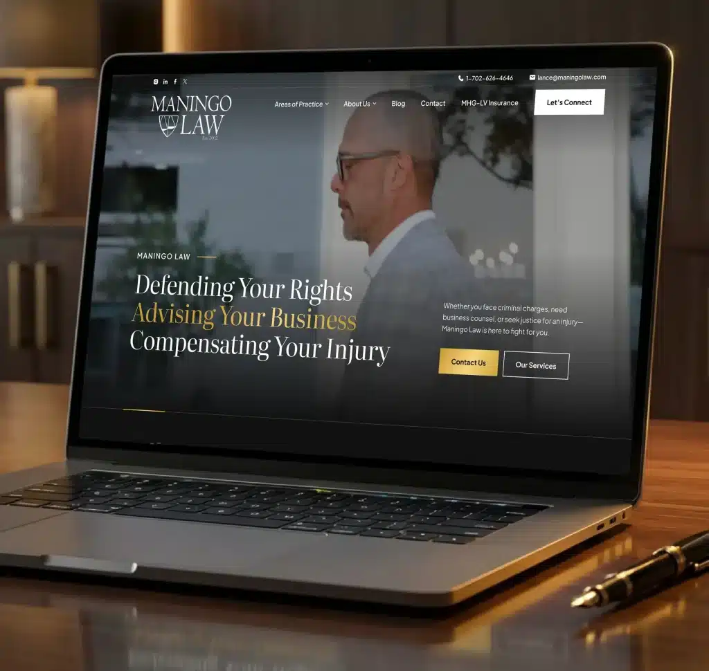 A laptop displays the "Maningo Law" website with text "Defending Your Rights, Advising Your Business, Compensating Your Injury."