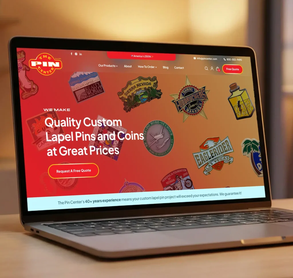 A laptop displays "The Pin Center" website, featuring "Quality Custom Lapel Pins and Coins at Great Prices" with various pin designs.