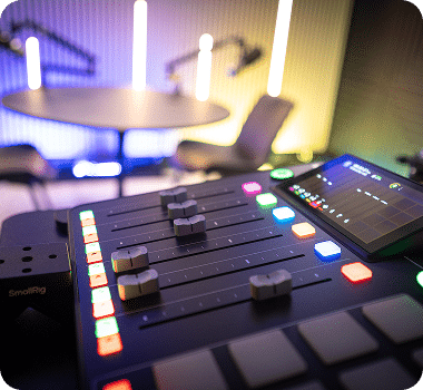 A close-up of a sound mixer with sliders and colorful buttons, a tablet, and a "SmallRig" logo.