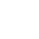 A white background with a faint, dark, circular shadow in the upper left corner.